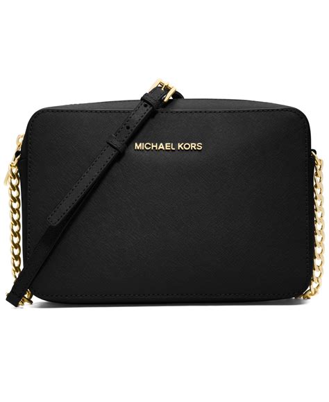 michael kors jet set travel crossgrain black and gold|Michael Kors jet set luggage.